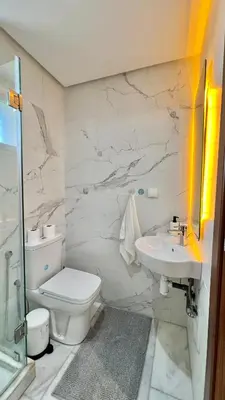 a bathroom with a toilet and a sink at N9 Appartement pied sur mer, La Corniche Rabat in Rabat