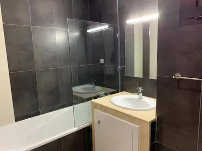 a bathroom with a sink and a mirror at Beautiful 3BR apartment in Hay Riad Rabat in Rabat