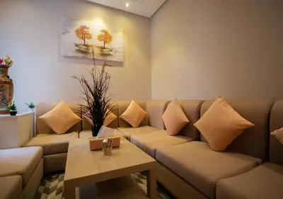 a living room with a couch and a table at R101- Cosy and stylish apartment with King Size Bed- Belvédère in Casablanca