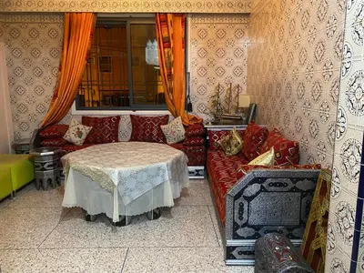 a living room with a couch and a table at Appartement oulfa in Casablanca