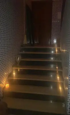 a group of stairs with lights on them at night at Grand appartement 3 chambre in Casablanca