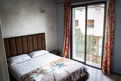 a bedroom with a bed and a large window at Grand appartement 3 chambre in Casablanca