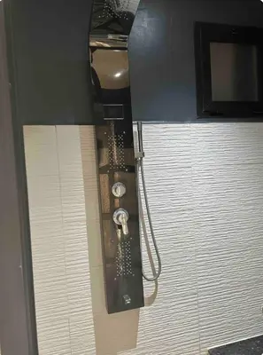 a shower in a bathroom with a hose attached at Chambre à Agdal Rabat dans un appartement partagé in Rabat