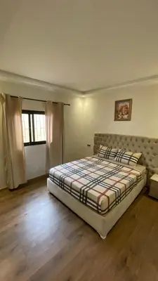 a bedroom with a large bed in a room at Modern rez de villa, jack beach Tamaris, Dar Bouaza in Casablanca