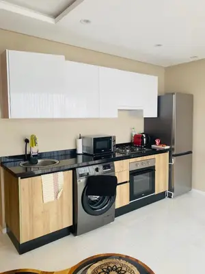 a kitchen with a stove and a dishwasher at Atlantic Suite View 2 in Casablanca