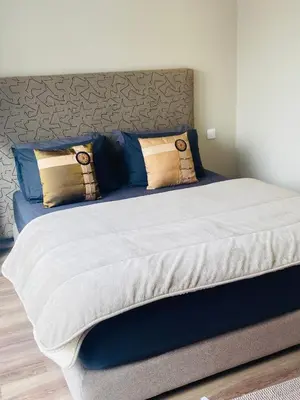 a large bed with pillows on top of it at Atlantic Suite View 2 in Casablanca
