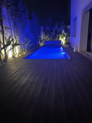 a swimming pool in a house at night at Villa de Luxe piscine privée in Casablanca