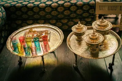 two glass tables with different colored candles on them at Appartement loft de luxe dans un quartier Art Déco en plein centre de Casablanca in Casablanca