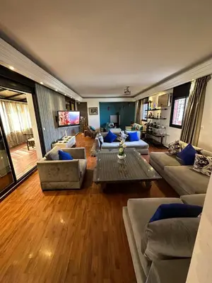 a large living room with couches and a table at Appartement loft de luxe dans un quartier Art Déco en plein centre de Casablanca in Casablanca