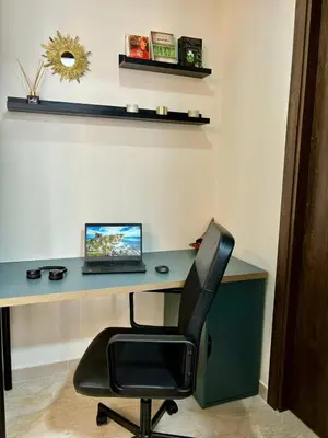 a desk with a laptop computer sitting on top of it at Au centre de Casablanca maarif in Casablanca