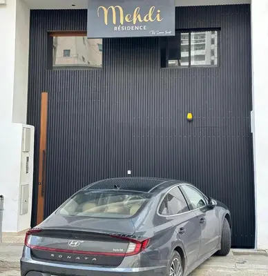 a car parked in front of a building at Au centre de Casablanca maarif in Casablanca