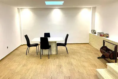 a dining room with a table and black chairs at Villa Havre De Paix à Casablanca in Casablanca