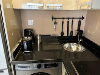 a small kitchen with a sink and a counter top at Studio cosy chic in Casablanca