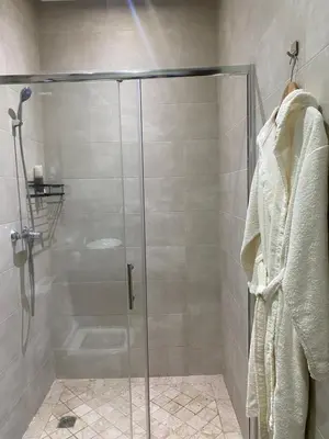 a shower with a glass door in a bathroom at Studio cosy chic in Casablanca