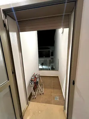 a view of a hallway through a glass door at Heaven Beach SIDI RAHAL in Sidi Rahal