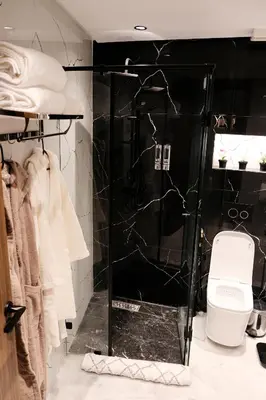 a bathroom with a shower with a toilet in it at New Apartment Casablanca City Center Maarif in Casablanca