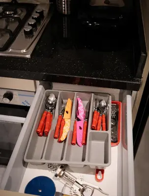 a group of utensils in a tray on a stove at New Apartment Casablanca City Center Maarif in Casablanca