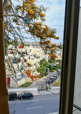 a view from a window of a street with cars at Dar Lamine Duplex in Rabat
