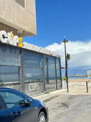 a car parked in front of a cvs store next to the beach at Appartement confortable au corniche in Mohammedia