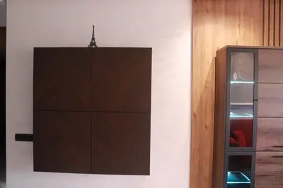 a brown cabinet against a wall next to a glass door at LUXE APPARTEMENT in Casablanca