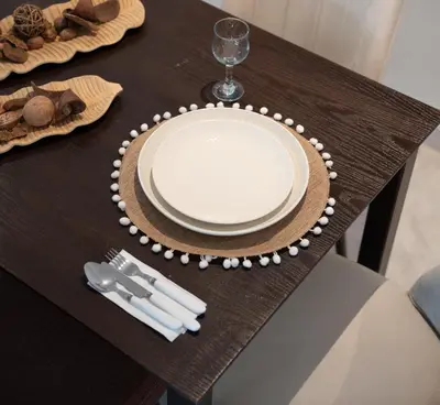 a table with a plate and fork and knife at Two bedrooms sunny appartement in ain diab in Casablanca