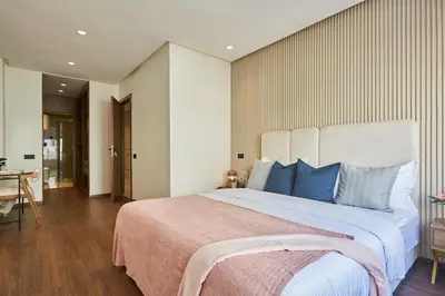 a bedroom with a large bed with blue pillows at Modern Elegance 3 Bed Escape in Trendy Casablanca in Casablanca