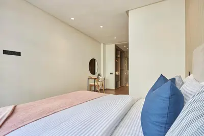 a bedroom with a large bed with blue pillows at Modern Elegance 3 Bed Escape in Trendy Casablanca in Casablanca