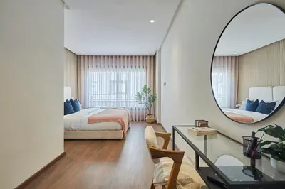 a hotel room with a bed and a mirror at Modern Elegance 3 Bed Escape in Trendy Casablanca in Casablanca