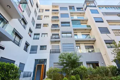 an apartment building with a white facade at Modern Elegance 3 Bed Escape in Trendy Casablanca in Casablanca