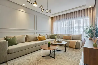 a living room with a couch and a table at Modern Elegance 3 Bed Escape in Trendy Casablanca in Casablanca