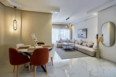 a living room with a table and a couch at Your Home Away from Home 2 Bed Flat With Parking in Casablanca
