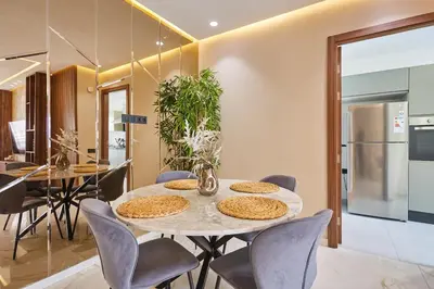 a kitchen and dining room with a table and chairs at Discover Casablanca Stay in our 3-Bed Gem with Parking in Casablanca
