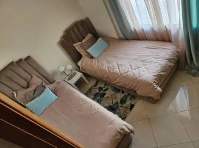 a bedroom with two beds and a window at Bel appartement en bord de mer in Casablanca