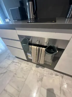a kitchen counter with a towel on a stove at Luxury Maarif Anfa Racine in Casablanca