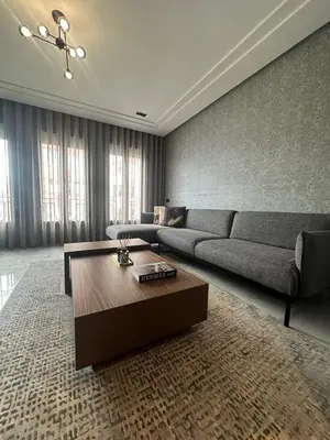 a living room with a couch and a coffee table at Luxury Maarif Anfa Racine in Casablanca