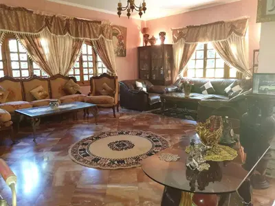 a living room with couches and a table at Villa entièrement meublée à louer à Mohammedia in Mohammedia