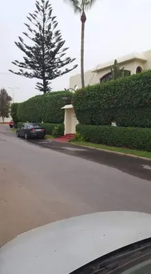 a car parked on a street in front of a house at Villa entièrement meublée à louer à Mohammedia in Mohammedia
