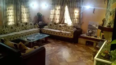 a living room with a couch and a table at Villa entièrement meublée à louer à Mohammedia in Mohammedia