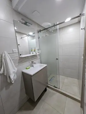 a bathroom with a sink and a shower at Cosy and Complete Casa appartment in Casablanca