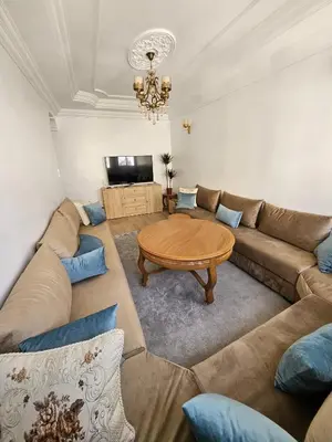 a living room with a couch and a table at Cosy and Complete Casa appartment in Casablanca
