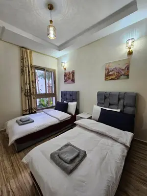 a bedroom with two beds and a window at MIA Appartement N1 - Élégance, Confort et Sérénité in Casablanca