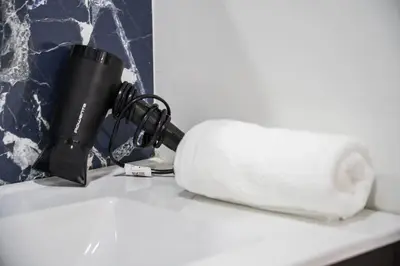 a camera and a roll of toilet paper on a counter at Chic Apartment Cosy Stay in Casablanca