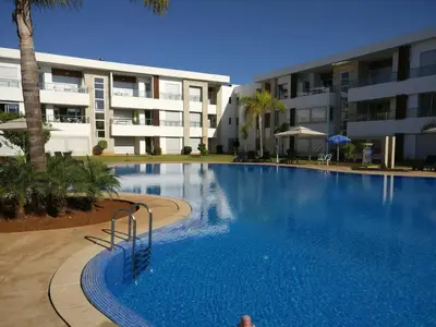 a large swimming pool in front of a building at My Cosy Place - Apartment 2BR - Piscine - Bahia Beach - Bouznika in Bouznika
