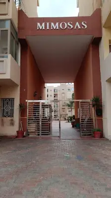 a entrance to a building with a minnesotaas sign on it at appartamento in residenza protetta con piscina in Mohammedia