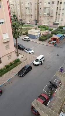 an aerial view of a city street with cars parked at appartamento in residenza protetta con piscina in Mohammedia