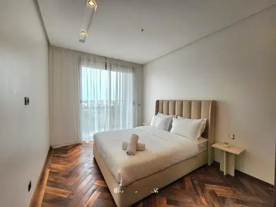a bedroom with a bed with a large window at Casa finance city - Anfa Park - CFC in Casablanca