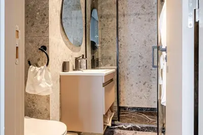 a bathroom with a sink and a mirror at Cozy Luxurious Bourgogne Studio in Casablanca
