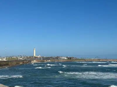 a body of water with a pier and waves at Casa Bay in Casablanca