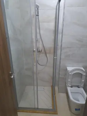 a bathroom with a shower and a toilet at Vacances Soleil Piscine & Plage Bouznika in Bouznika