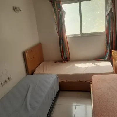 a small room with two beds and a window at Captivating 4-Bed House in Tamaris in Tamaris
